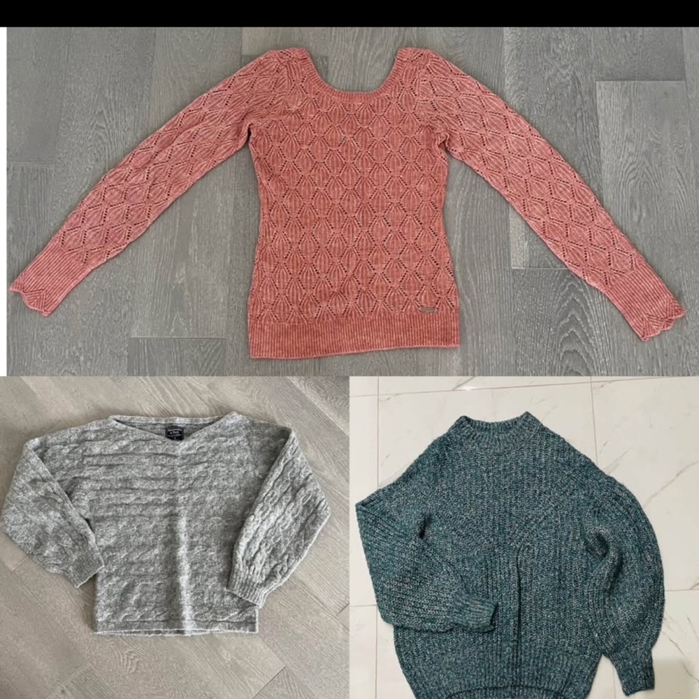Three knit sweaters
